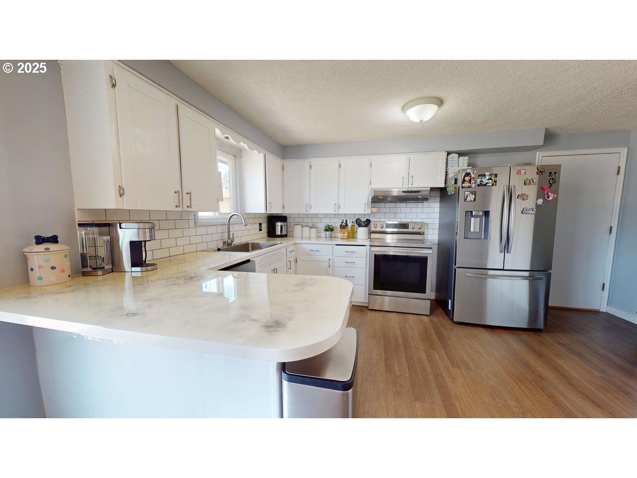 2130 Yolanda Avenue Springfield, OR 97477 - Photo 19 of 30 a kitchen with refrigerator cabinets and a sink