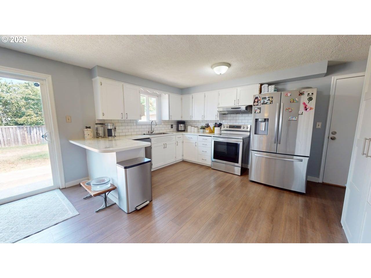 2130 Yolanda Avenue Springfield, OR 97477 - Photo 20 of 30 a kitchen with appliances a sink and a refrigerator