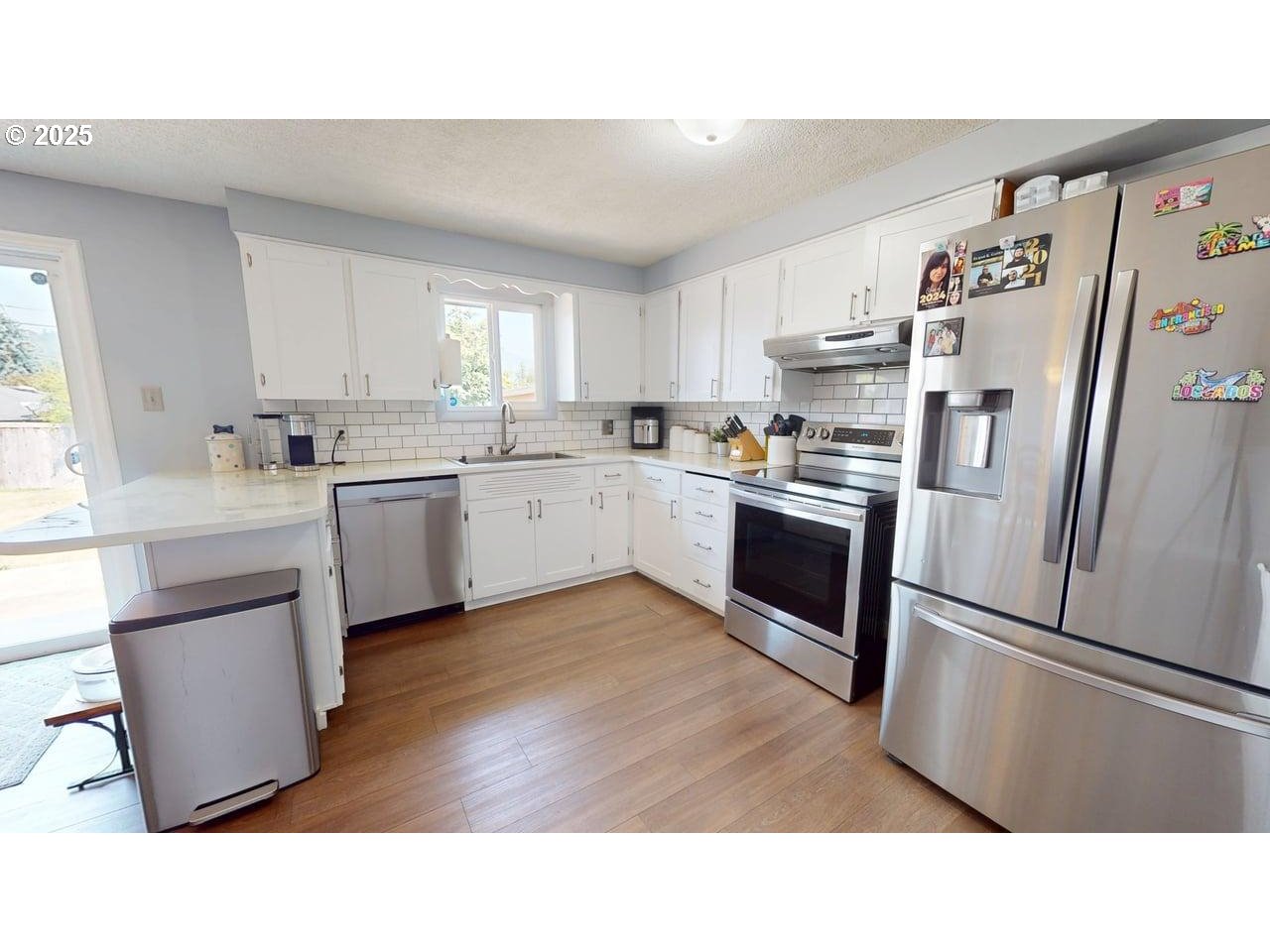 2130 Yolanda Avenue Springfield, OR 97477 - Photo 23 of 30 a kitchen with cabinets and stainless steel appliances