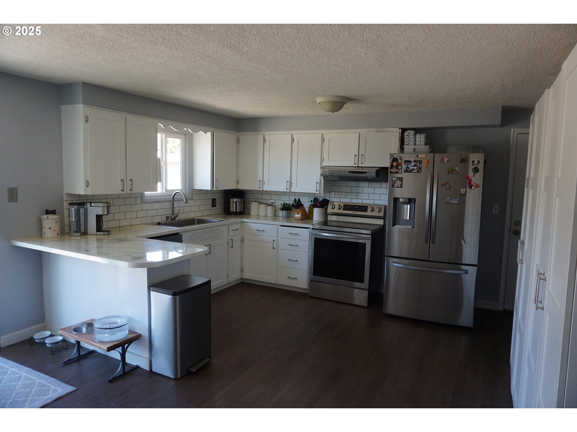 2130 Yolanda Avenue Springfield, OR 97477 - Photo 7 of 30 a kitchen with stainless steel appliances granite countertop a sink stove and refrigerator