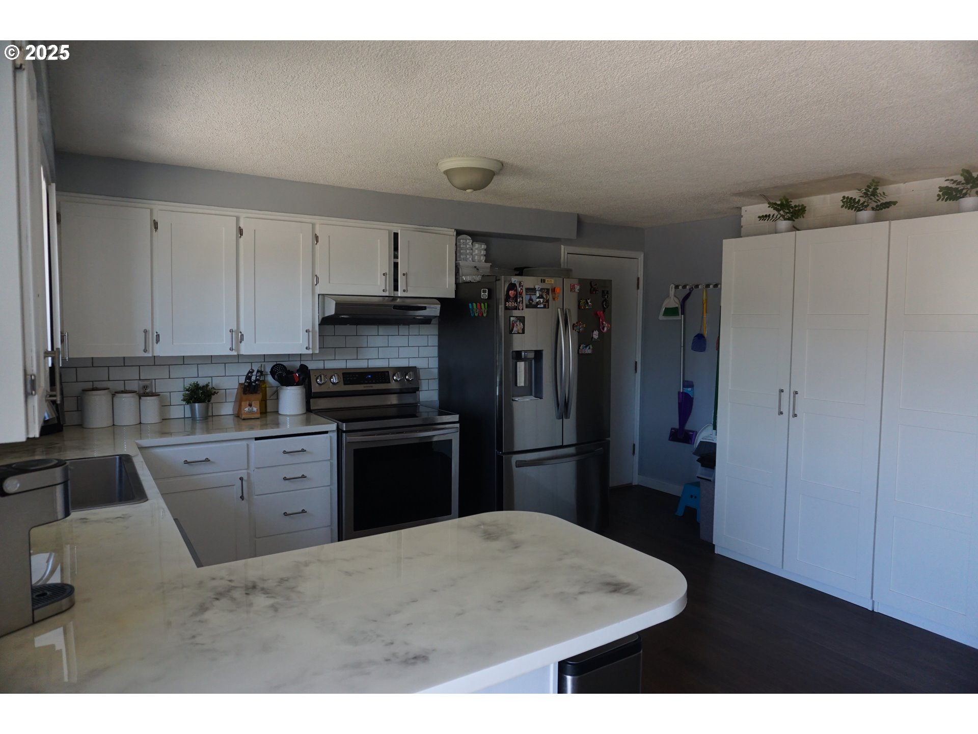 2130 Yolanda Avenue Springfield, OR 97477 - Photo 9 of 30 a kitchen with a refrigerator and a stove top oven