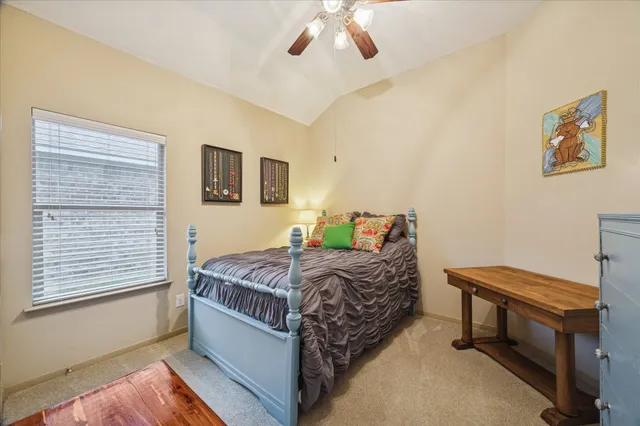 a bedroom with bed and a window