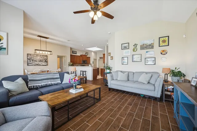 a living room with furniture and kitchen view