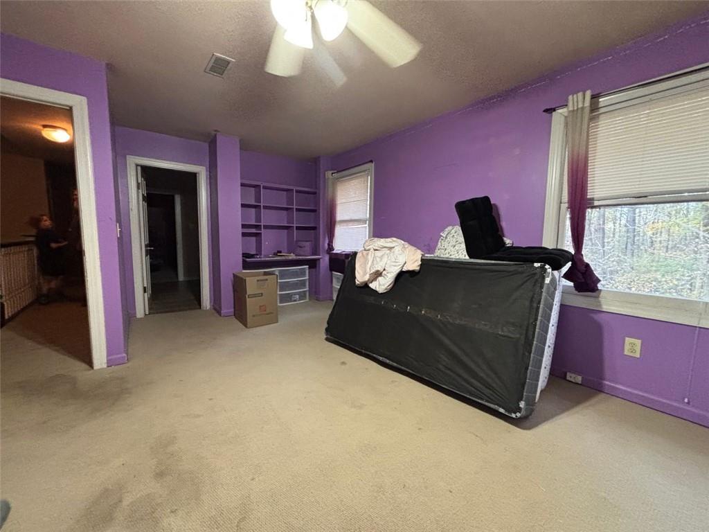 4926 Maroney Mill Road Douglasville, GA 30134 - Photo 15 of 26 a living room with furniture and a flat screen tv