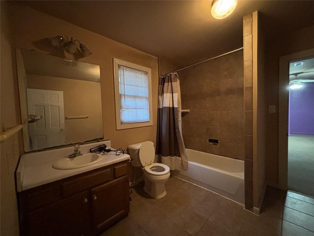 4926 Maroney Mill Road Douglasville, GA 30134 - Photo 17 of 26 a bathroom with a double vanity sink toilet mirror and shower