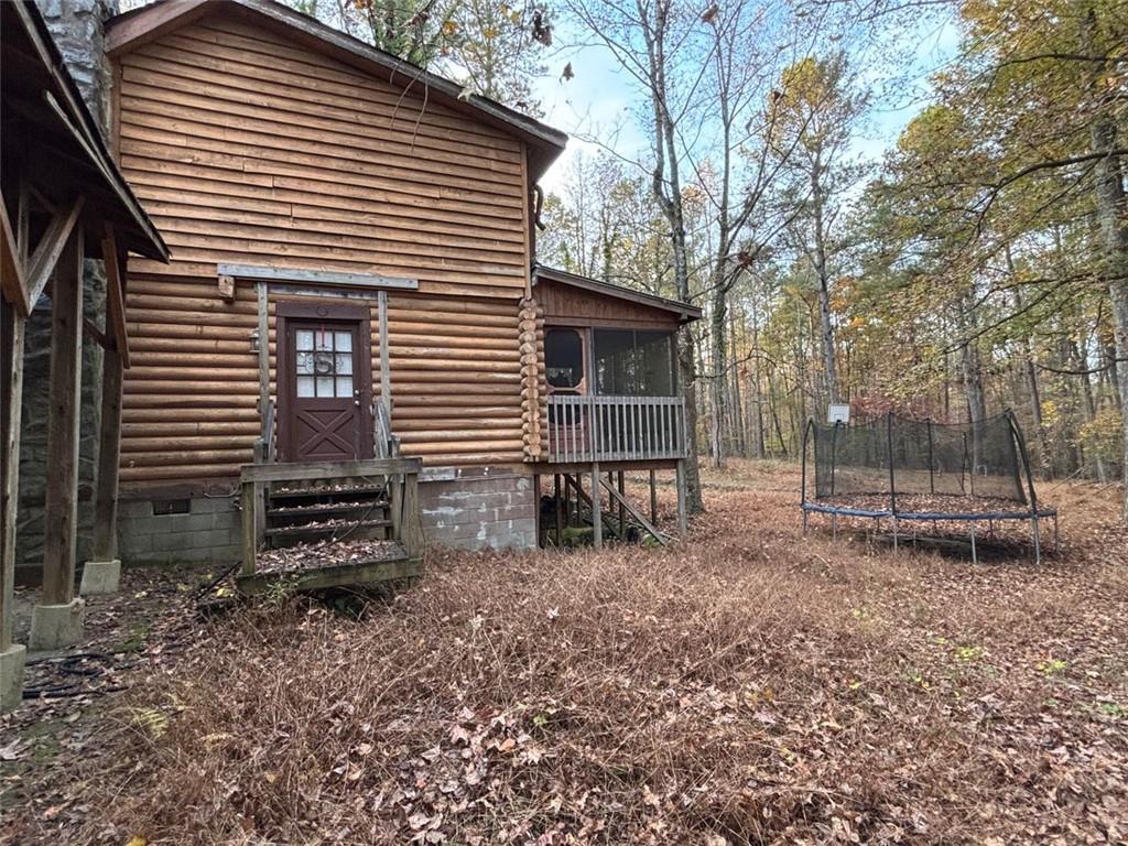 4926 Maroney Mill Road Douglasville, GA 30134 - Photo 3 of 26 a backyard of a house with plants and trees