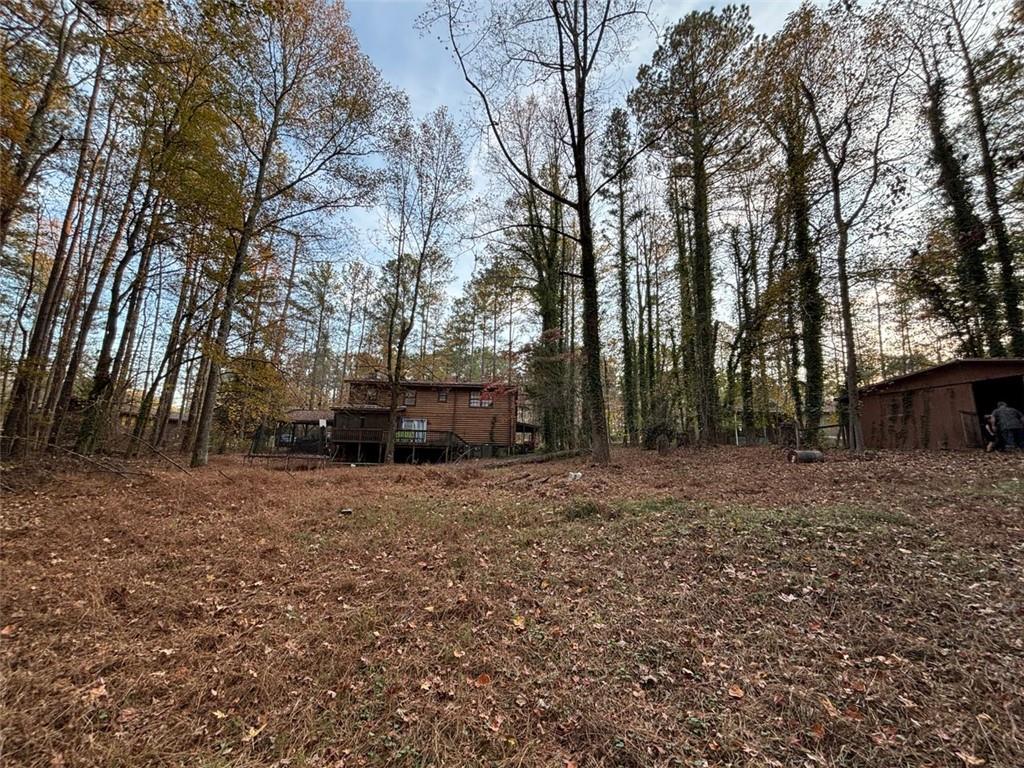 4926 Maroney Mill Road Douglasville, GA 30134 - Photo 5 of 26 a view of a backyard with large trees