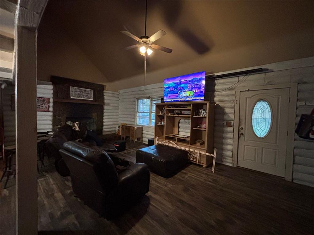 4926 Maroney Mill Road Douglasville, GA 30134 - Photo 9 of 26 a living room with furniture a fireplace and a flat screen tv