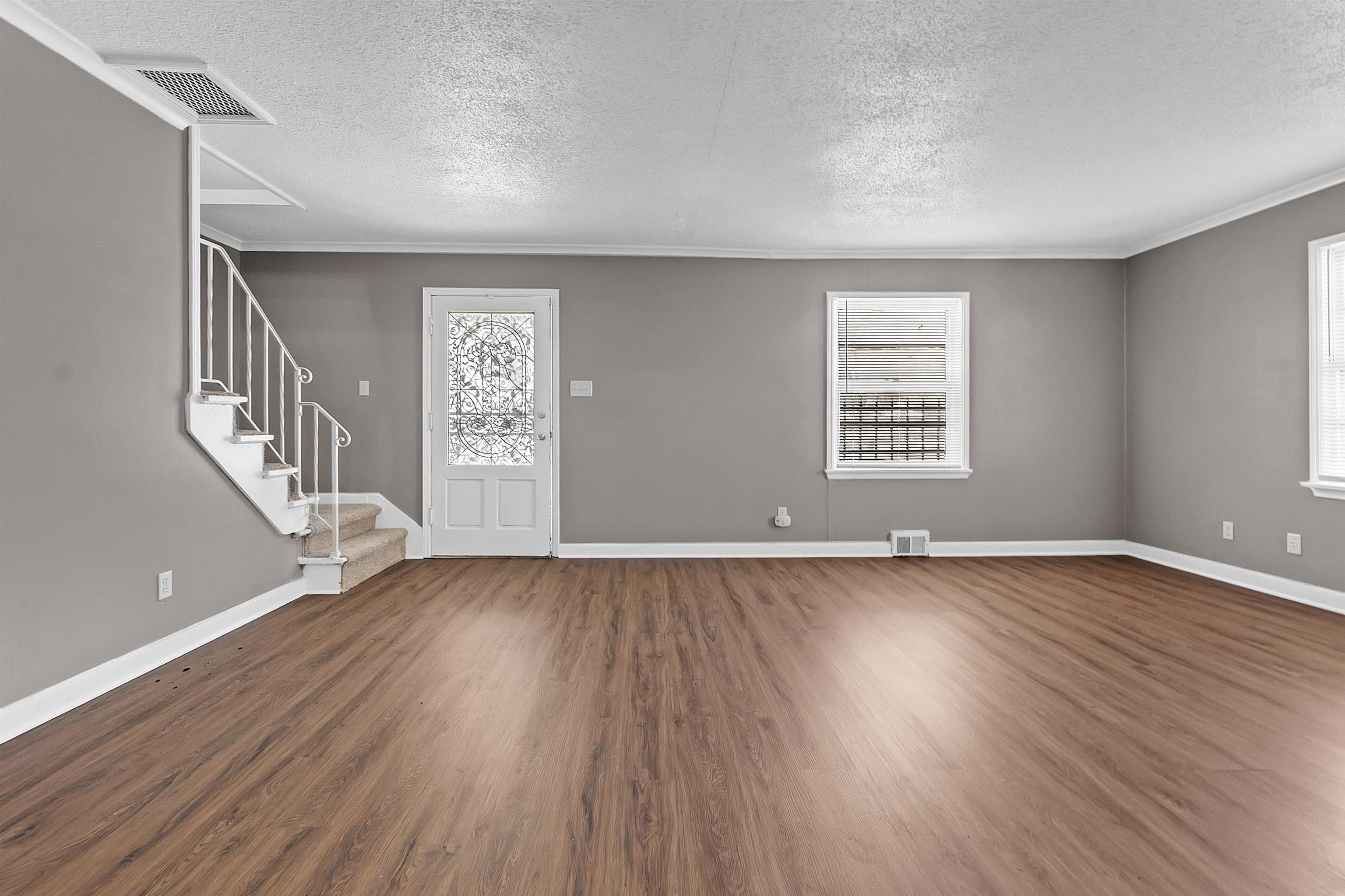 1526 Railton Road Memphis, TN 38111 - Photo 15 of 22 Foyer featuring a textured ceiling and dark wood-type flooring