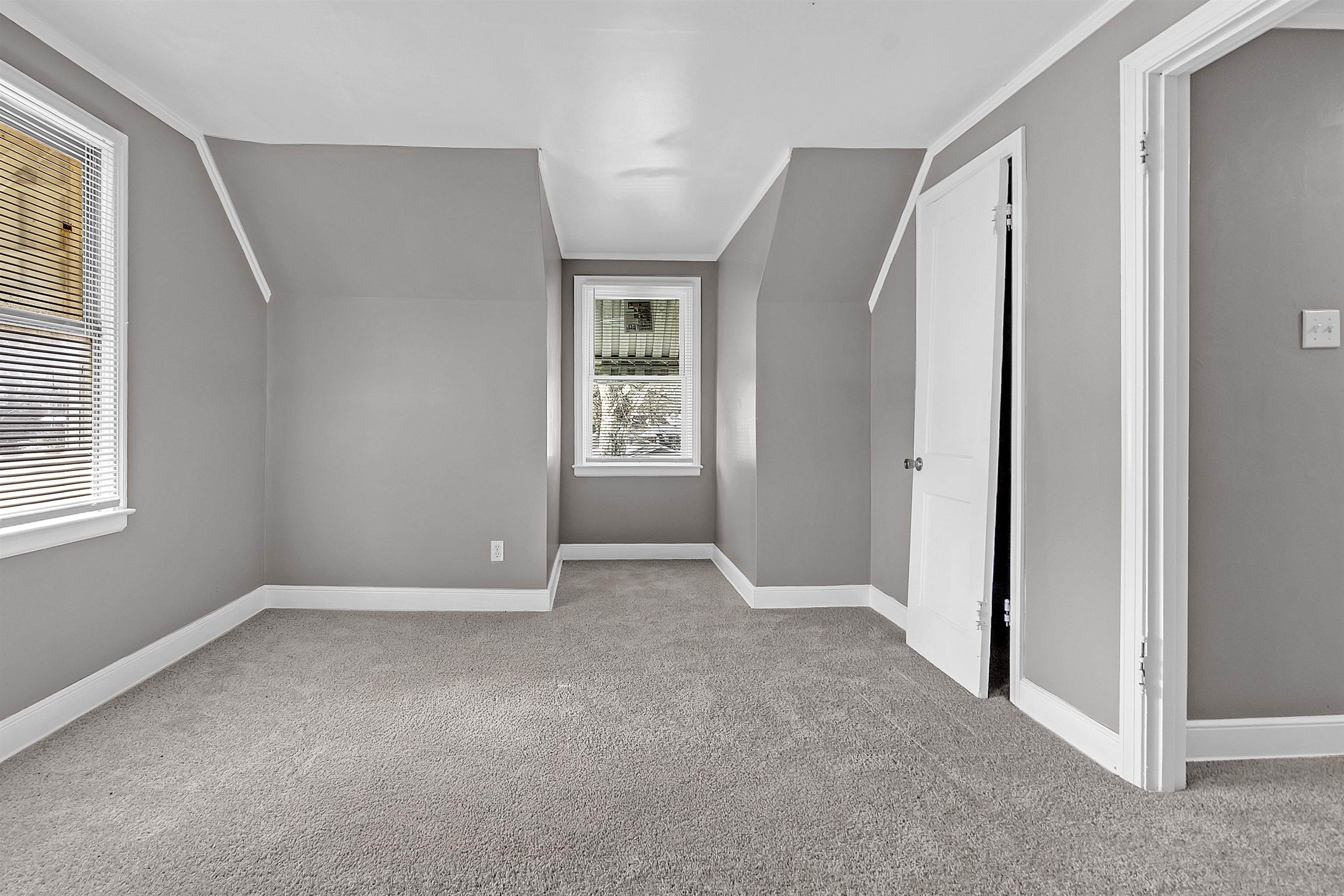 1526 Railton Road Memphis, TN 38111 - Photo 16 of 22 Additional living space with light colored carpet and vaulted ceiling