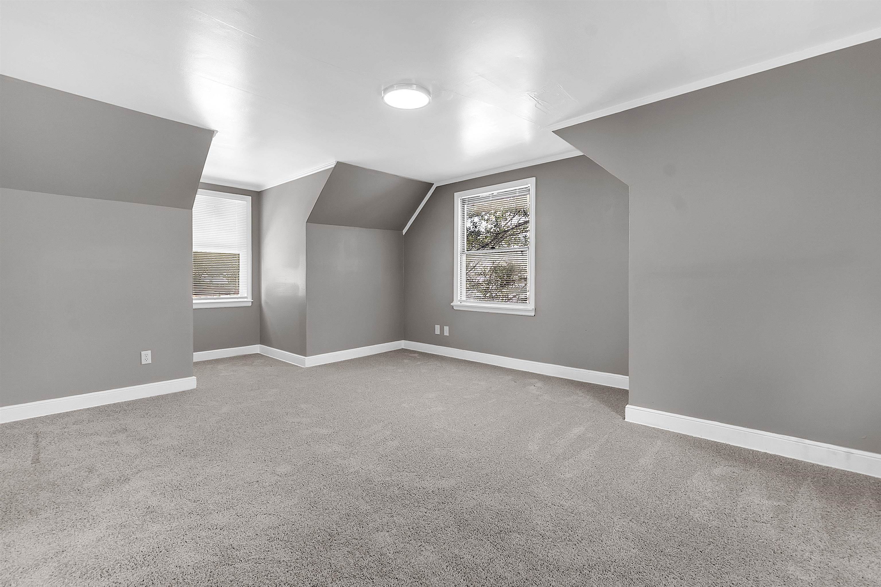 1526 Railton Road Memphis, TN 38111 - Photo 19 of 22 Additional living space with light carpet and vaulted ceiling