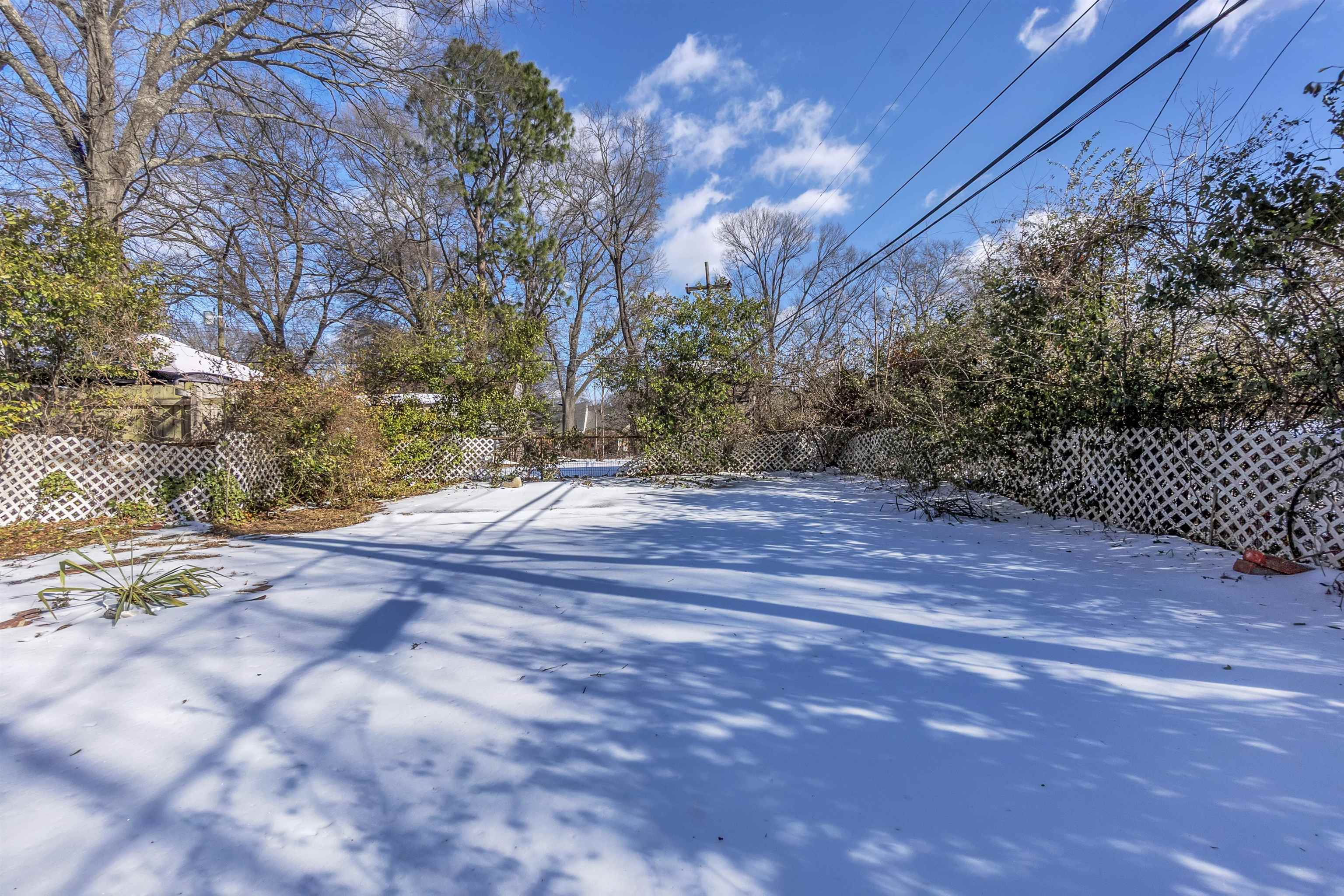 1526 Railton Road Memphis, TN 38111 - Photo 21 of 22 Yard covered in snow with a fenced backyard