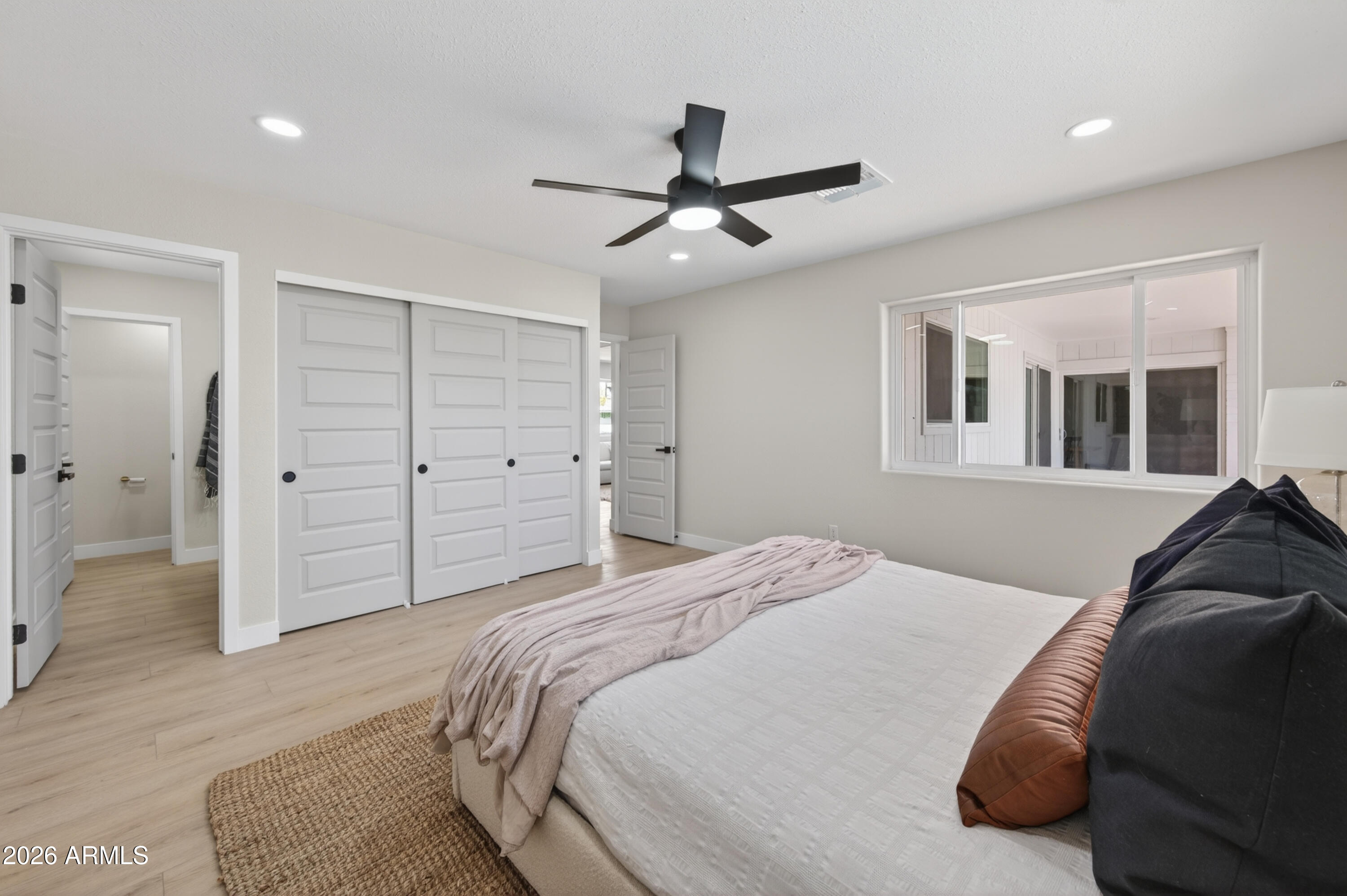 3422 South Terrace Road Tempe, AZ 85282 - Photo 17 of 43 a bedroom with a bed and a walk in closet