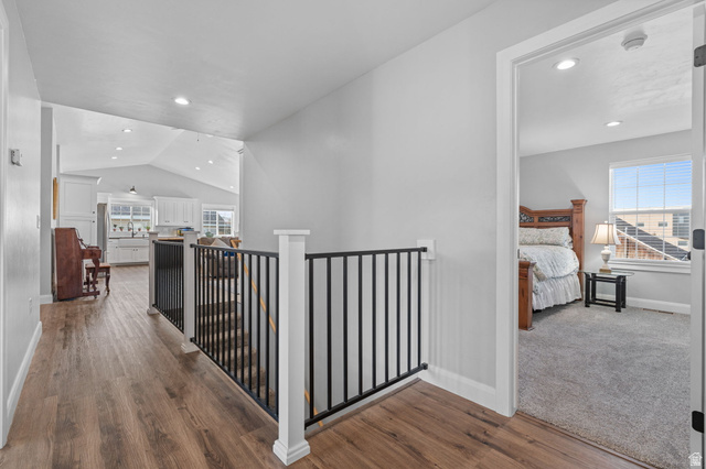 75 North 100th Street West Fillmore, UT 84631 - Photo 19 of 62 Hallway, recessed lighting, dark wood-style floors, and an upstairs landing