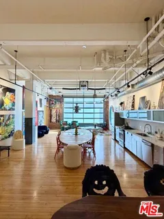 a dining room with a table and chairs