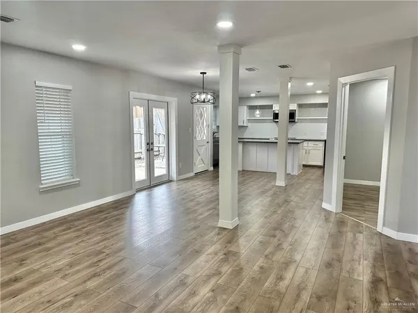 a view of a kitchen with a sink and a refrigerator