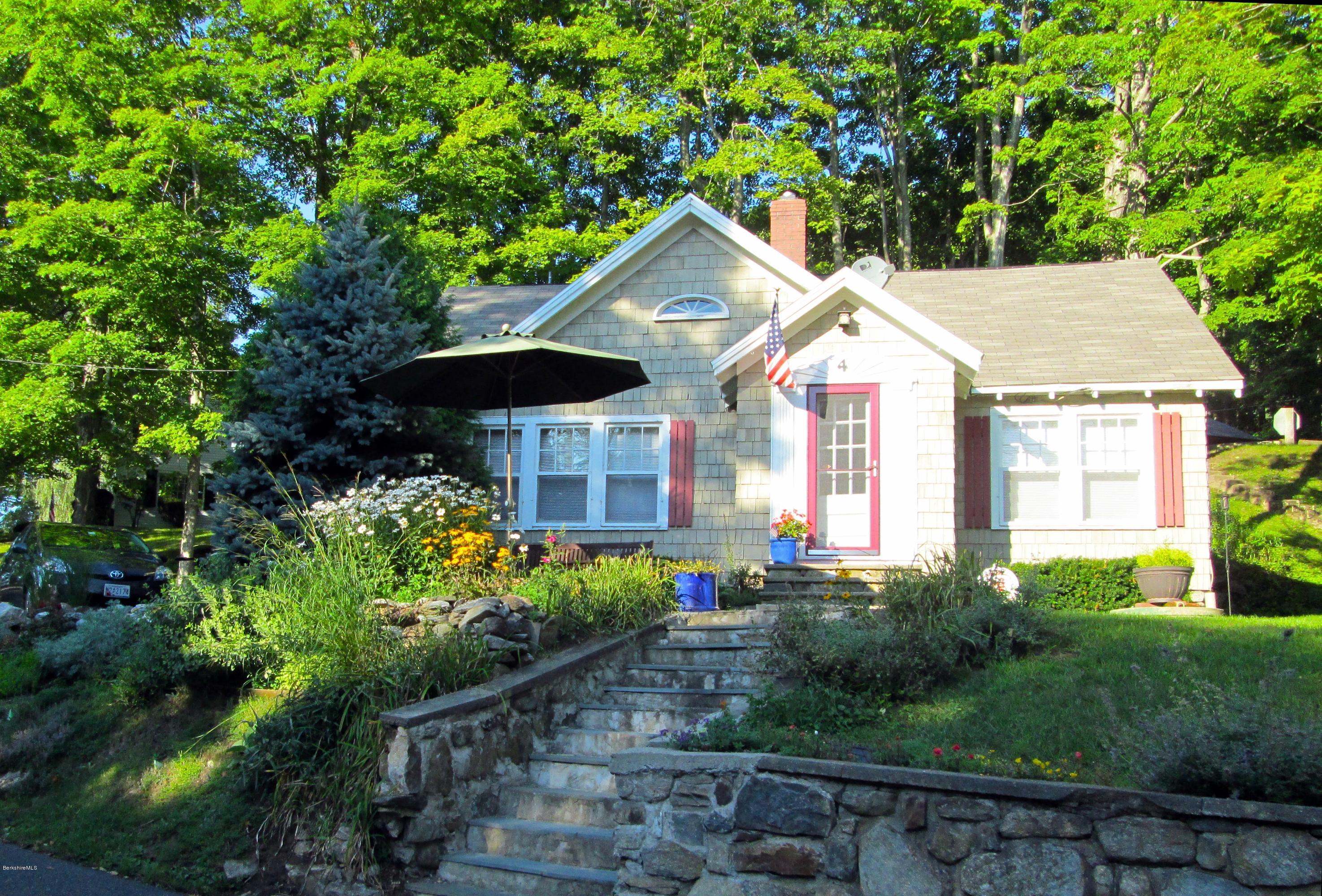 4 Tyringham Road Monterey, MA 01245 - Photo 1 of 26 a front view of a house with a yard and fountain