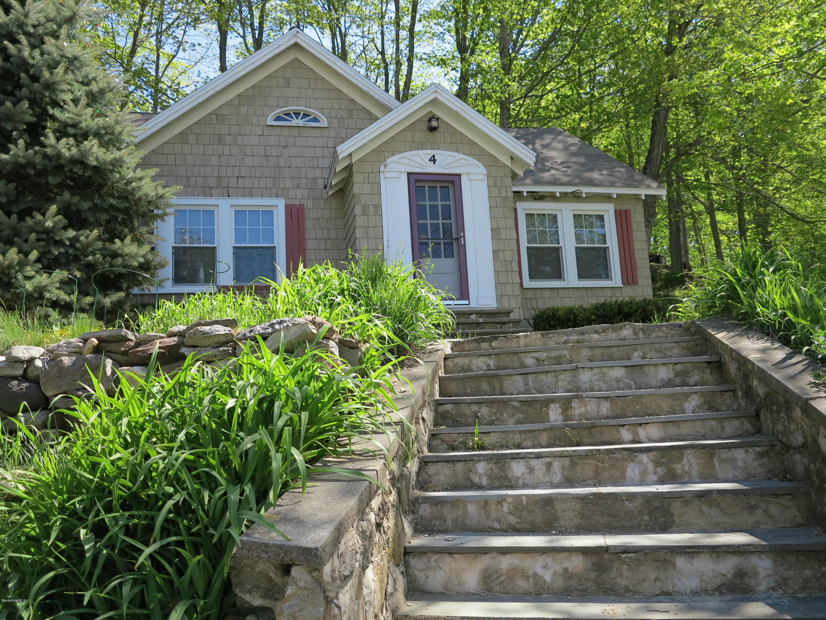 4 Tyringham Road Monterey, MA 01245 - Photo 20 of 26 a front view of a house with a yard