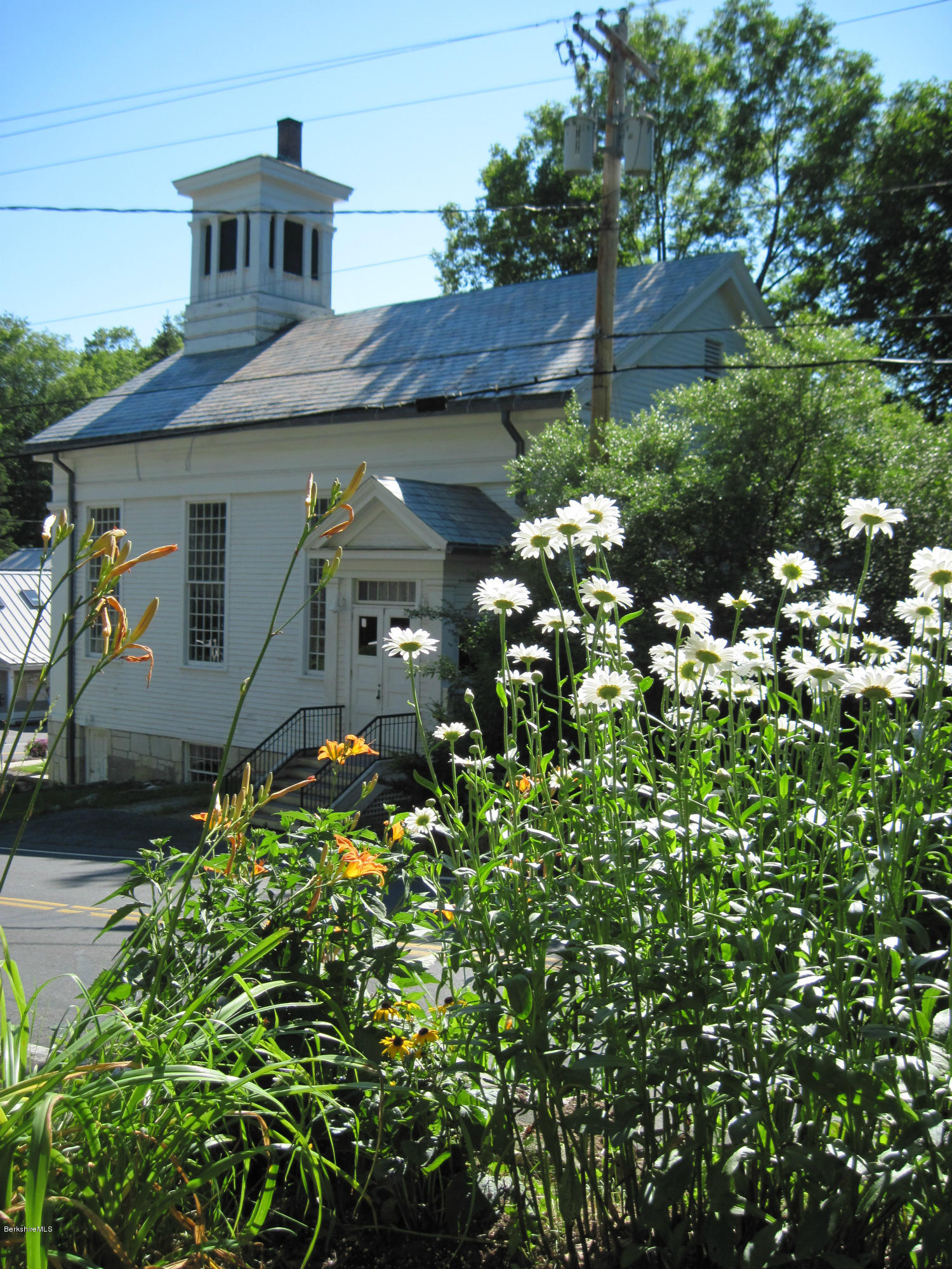 4 Tyringham Road Monterey, MA 01245 - Photo 22 of 26 a view of a house with a flower garden