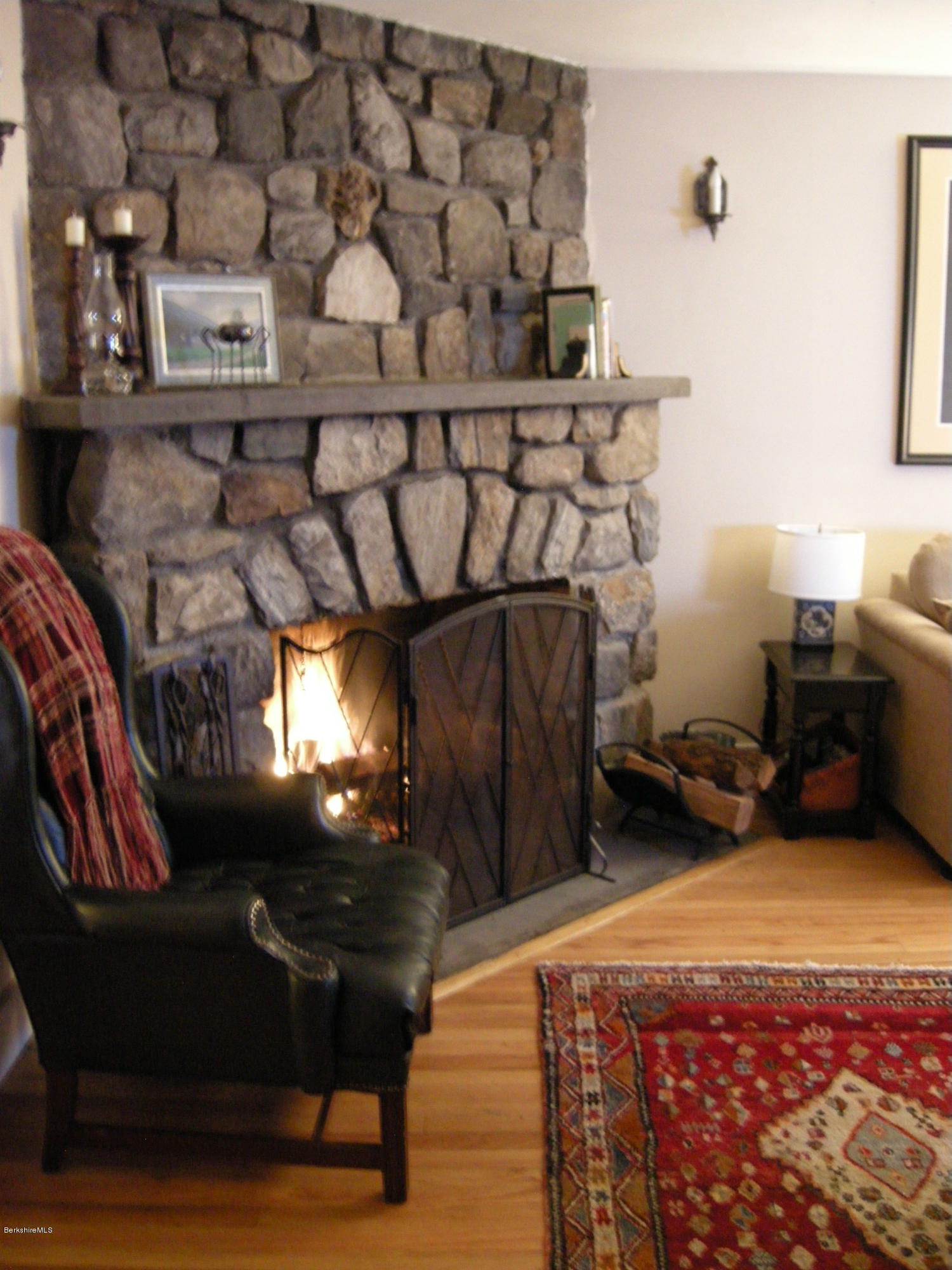 4 Tyringham Road Monterey, MA 01245 - Photo 4 of 26 a living room with a couch and a fireplace