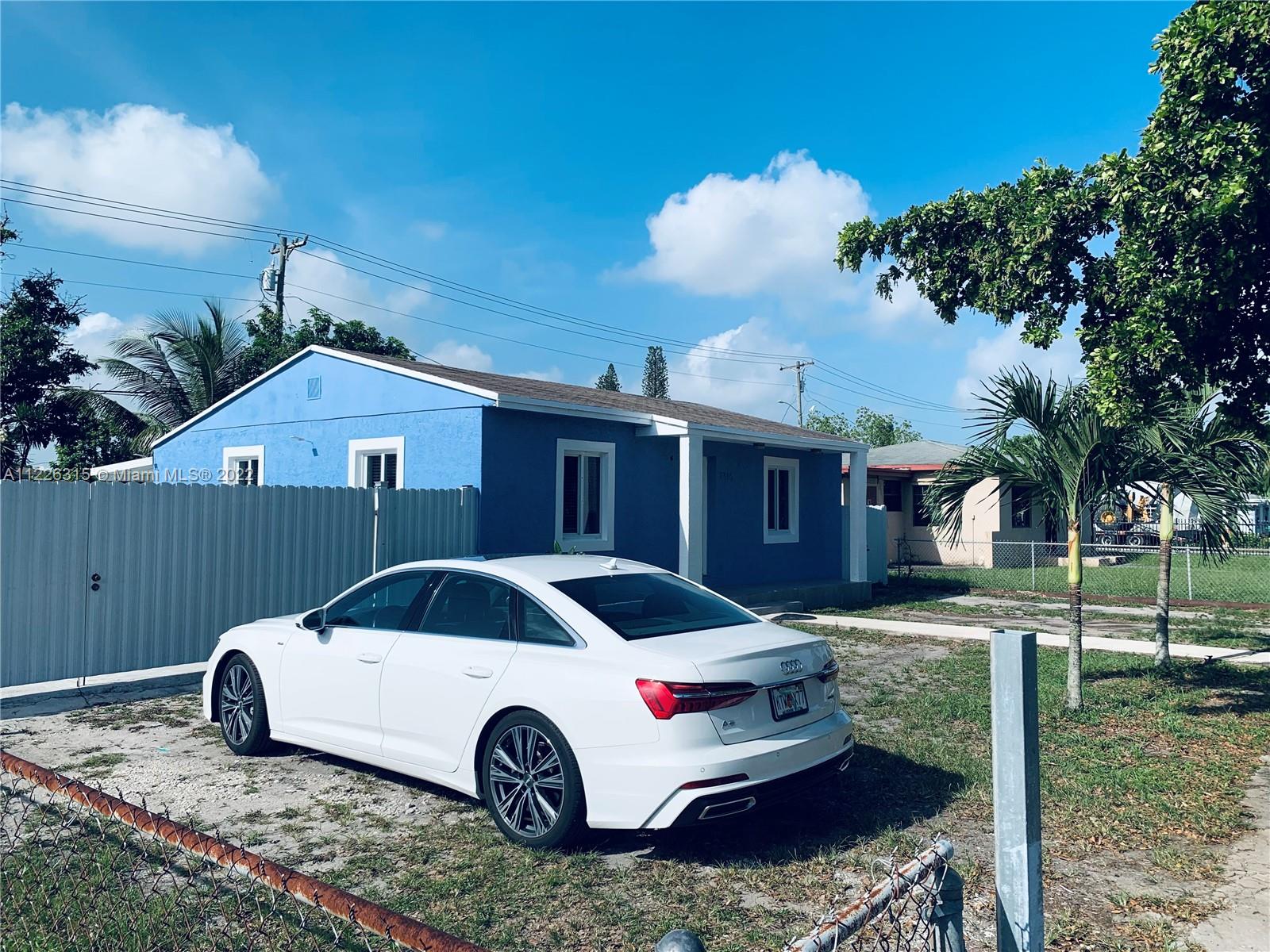 1315 Northwest 86th Street Miami, FL 33147 - Photo 16 of 16 a front view of a house with a yard