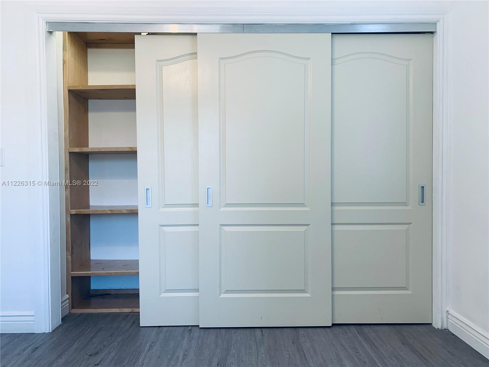 1315 Northwest 86th Street Miami, FL 33147 - Photo 6 of 16 a view of an empty walk in closet