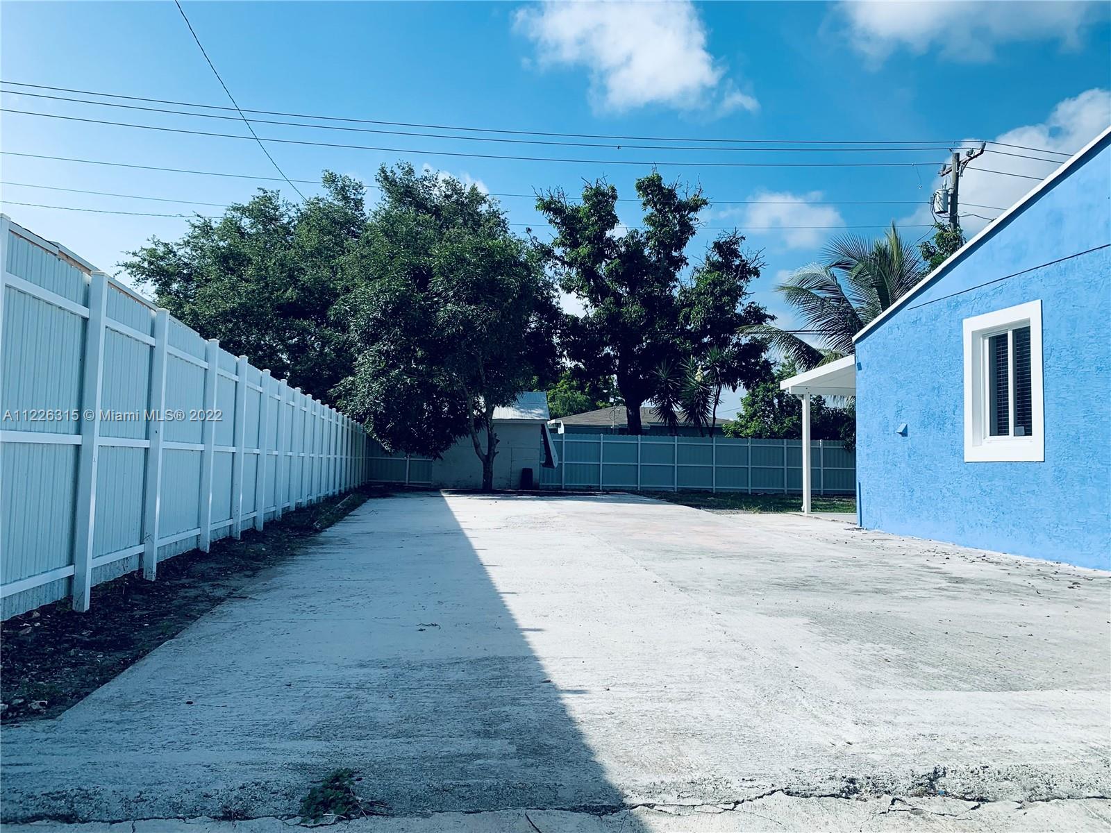 1315 Northwest 86th Street Miami, FL 33147 - Photo 7 of 16 a view of a backyard of the house