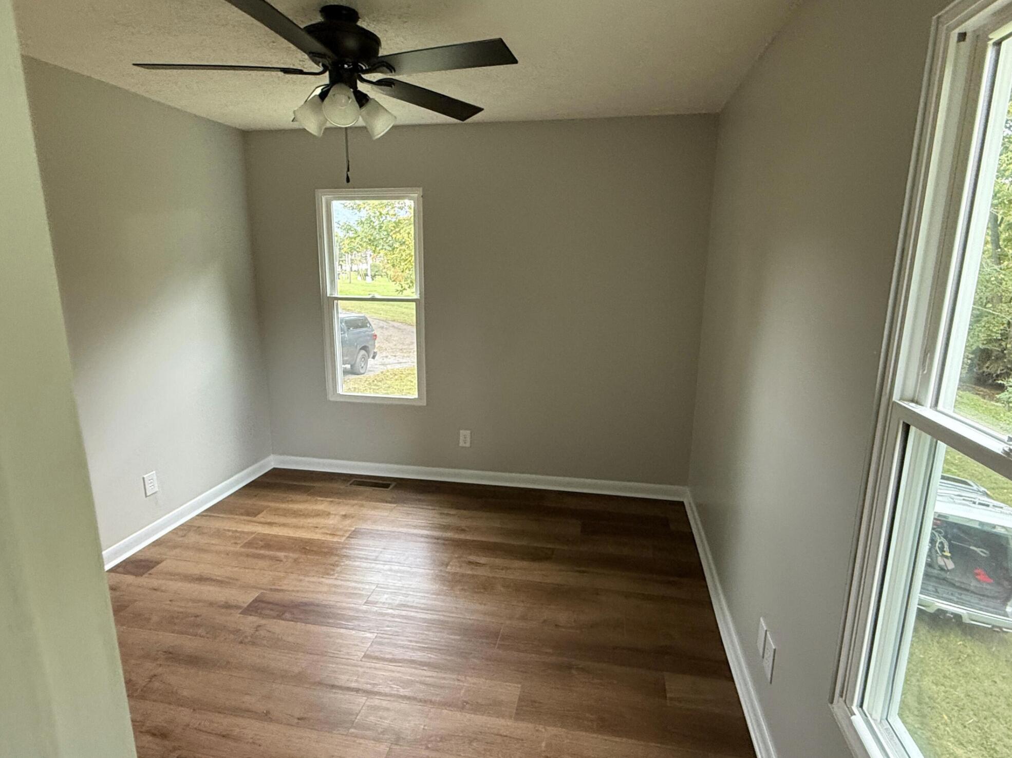 3465 Webster Road Blue Ridge, VA 24064 - Photo 11 of 13 an empty room with windows and fan