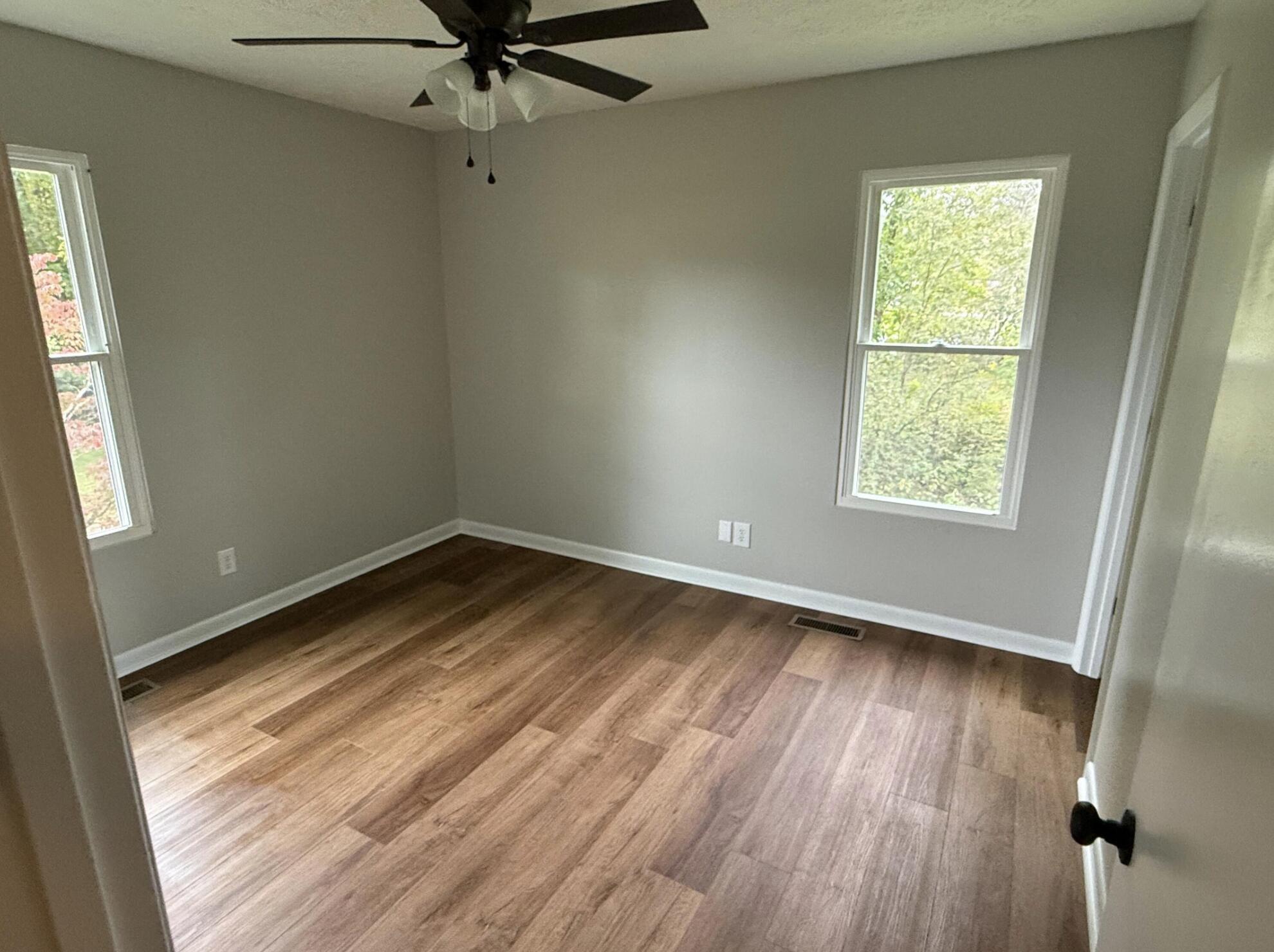 3465 Webster Road Blue Ridge, VA 24064 - Photo 12 of 13 wooden floor in an empty room with a window