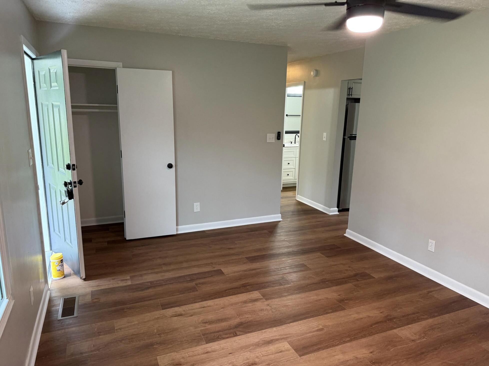 3465 Webster Road Blue Ridge, VA 24064 - Photo 2 of 13 an empty room with wooden floor and windows