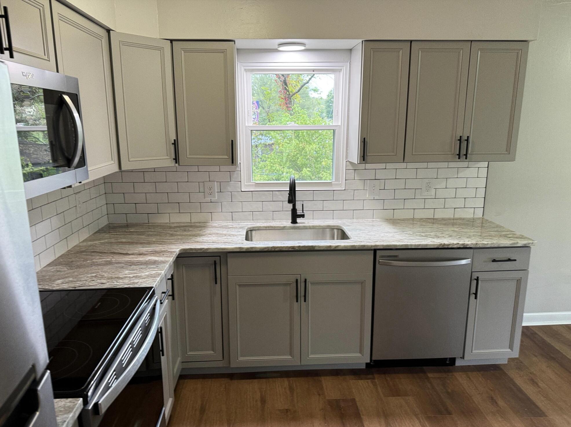 3465 Webster Road Blue Ridge, VA 24064 - Photo 5 of 13 a kitchen with stainless steel appliances granite countertop a sink and a microwave