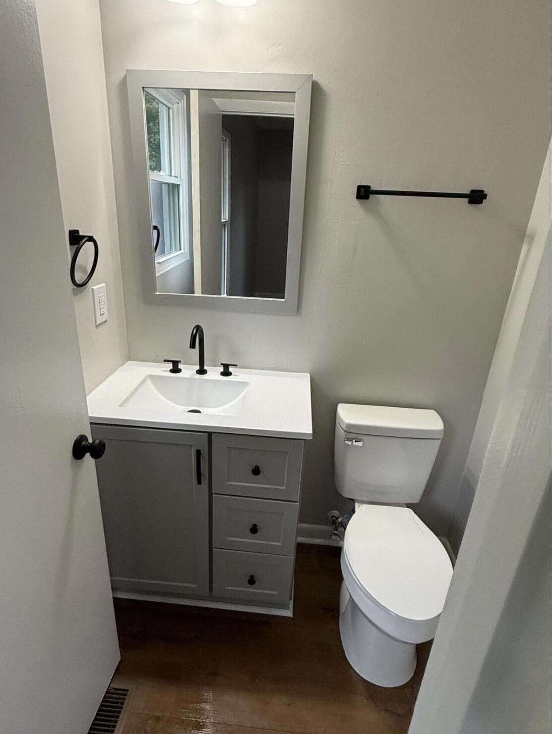 3465 Webster Road Blue Ridge, VA 24064 - Photo 9 of 13 a bathroom with a toilet sink and mirror
