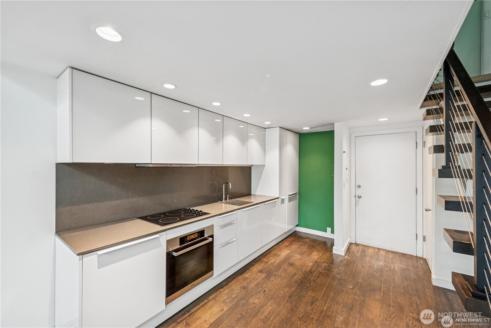 1000 Union Street, Unit 402 Seattle, WA 98101 - Photo 3 of 10 a view of kitchen with microwave and stove
