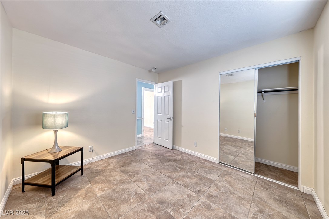 632 Arrayo Way Boulder City, NV 89005 - Photo 31 of 40 Unfurnished bedroom featuring a closet and baseboards