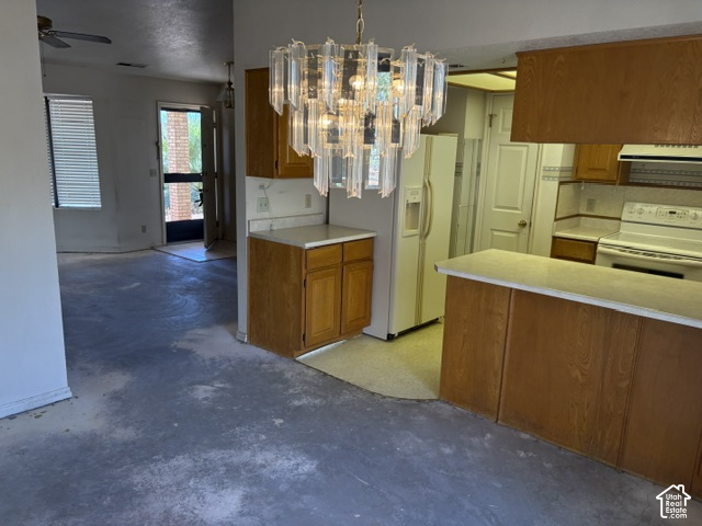 2164 West 2000 North St. George, UT 84770 - Photo 10 of 26 Kitchen to semi-formal dining area with a decorative chandelier