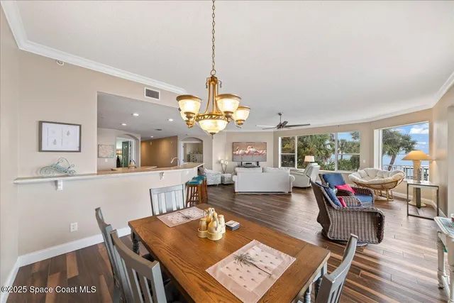 a view of a hallway with wooden floor and entryway