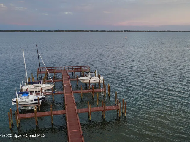 a view of a balcony with a yard