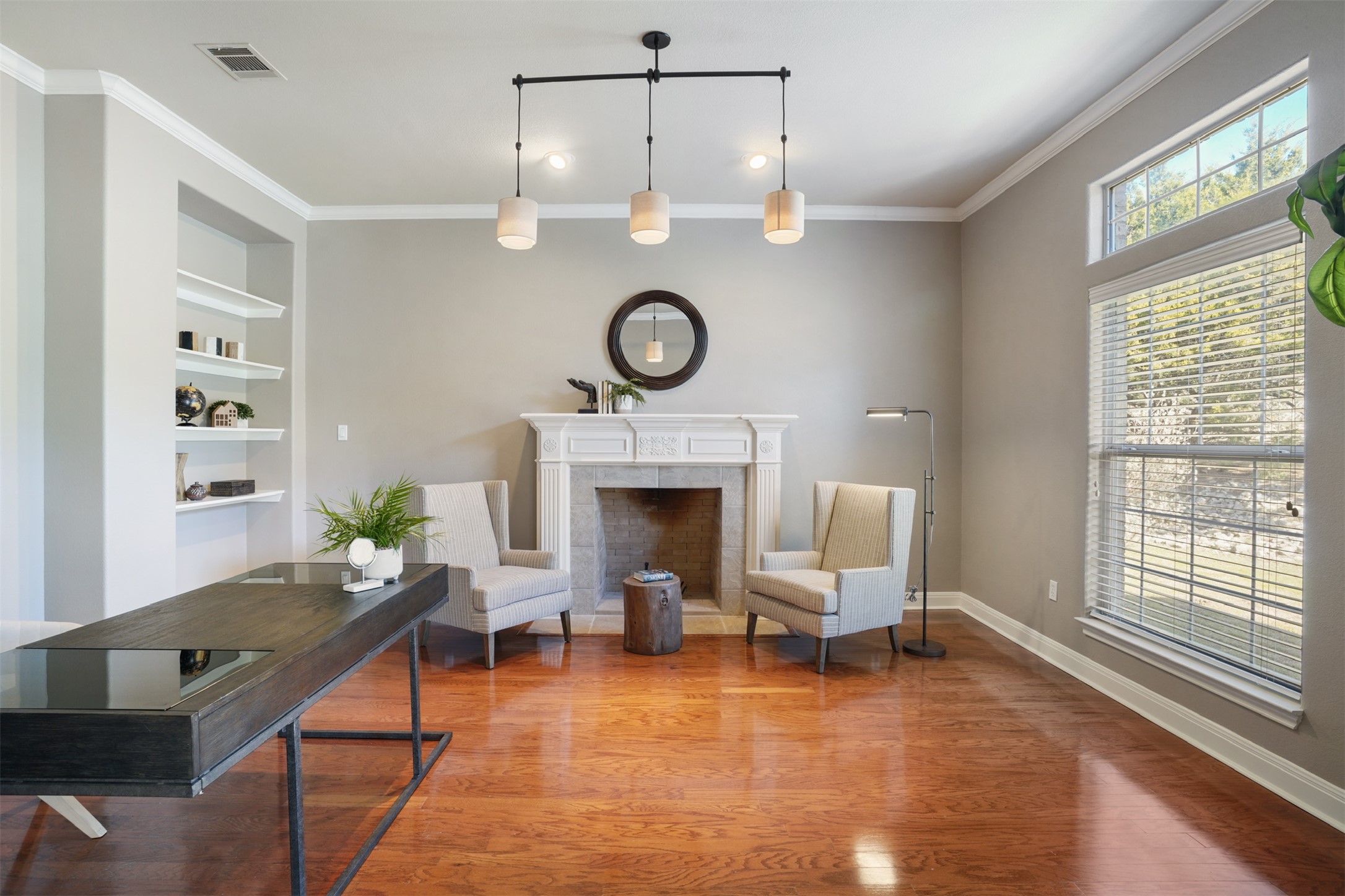 710 Timarron Leander, TX 78641 - Photo 4 of 22 Spacious study with built in shelving and a wood burning fireplace