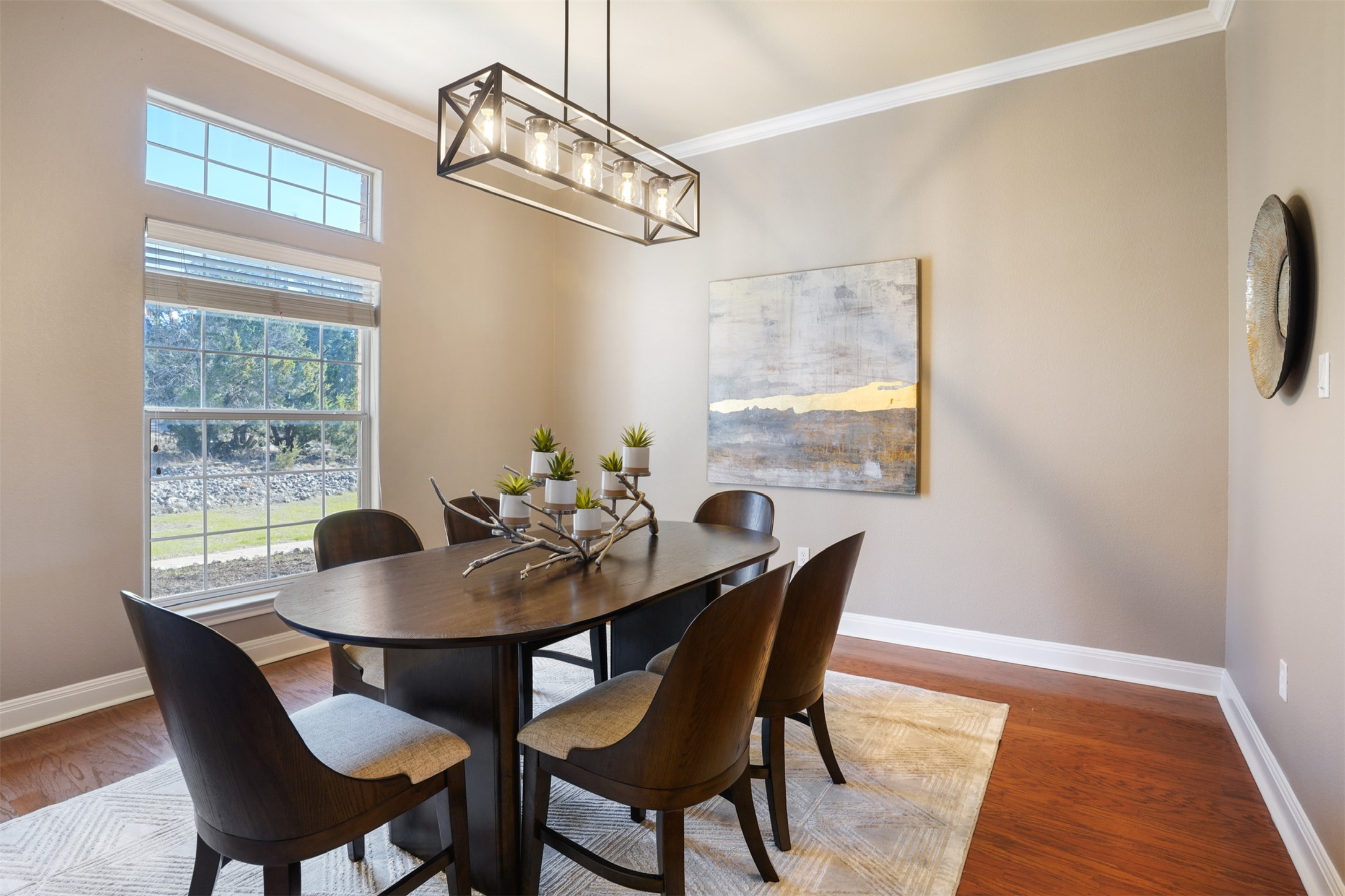 710 Timarron Leander, TX 78641 - Photo 5 of 22 Formal dining featuring beautiful views of the trees, modern lighting, and crown molding