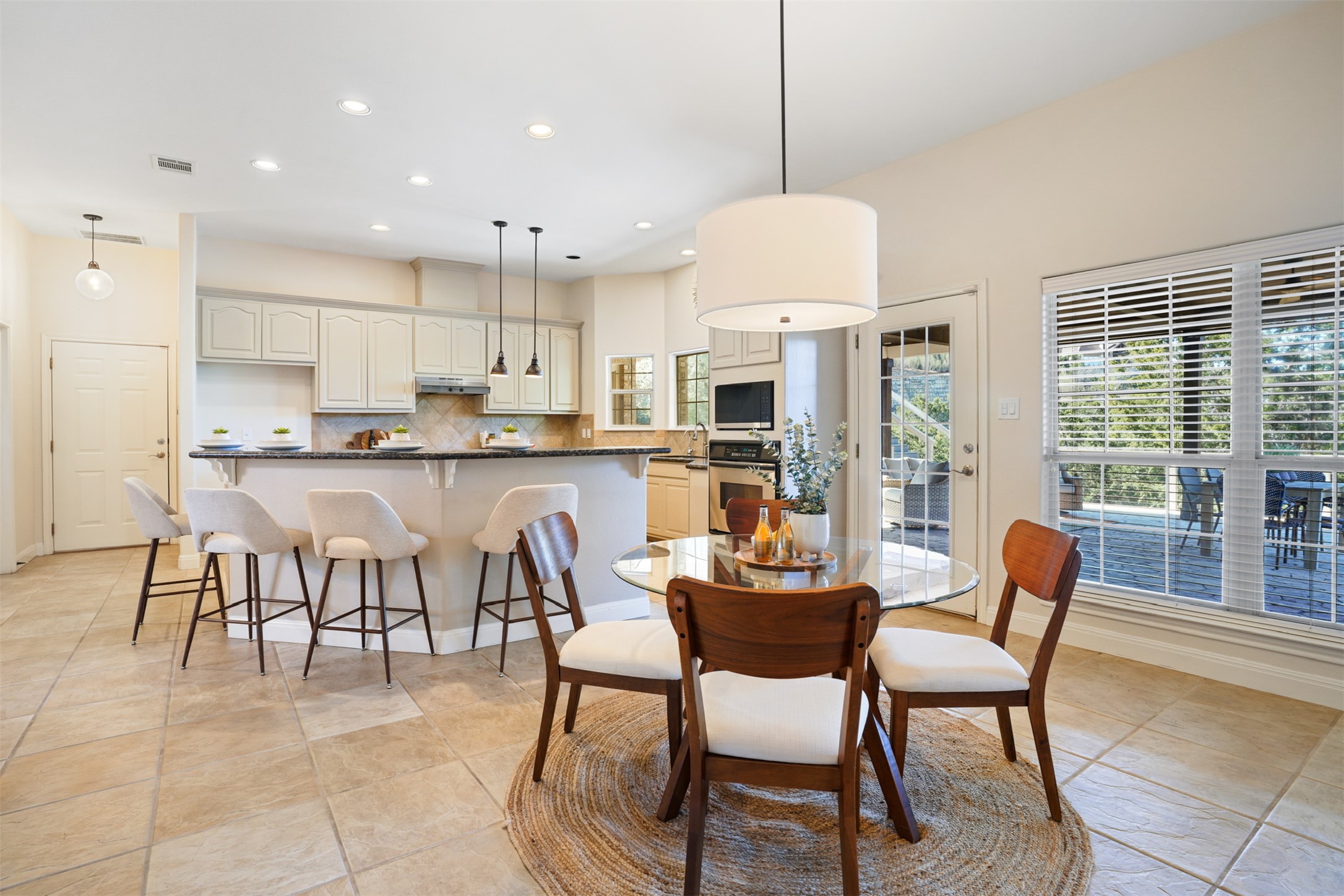 710 Timarron Leander, TX 78641 - Photo 9 of 22 Dine-in bar opens to additional breakfast area dining space