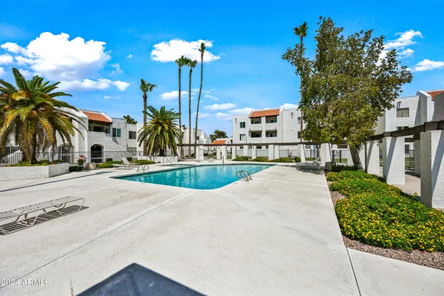a view of a swimming pool with a patio