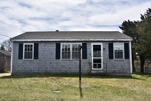 28 Harbor View Road Bourne, MA 02559 - Photo 1 of 14 a front view of a house with a yard