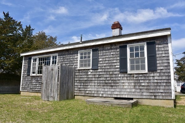 28 Harbor View Road Bourne, MA 02559 - Photo 3 of 14 a front view of a house with a yard