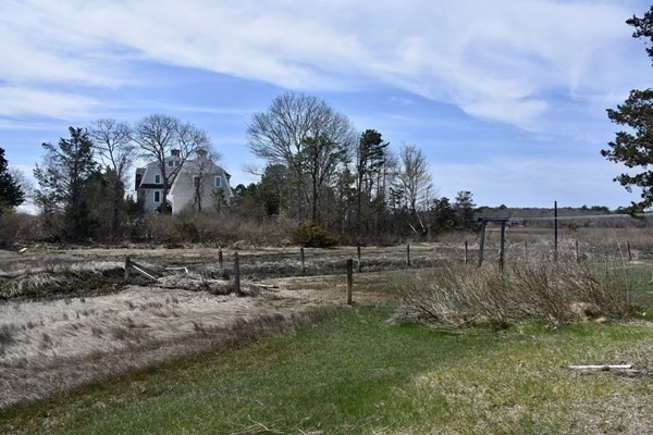 28 Harbor View Road Bourne, MA 02559 - Photo 4 of 14 a view of a field with trees in background