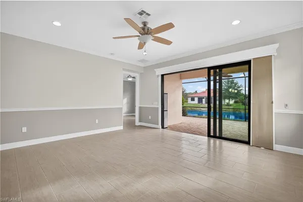 a view of kitchen with stainless steel appliances refrigerator oven and cabinets
