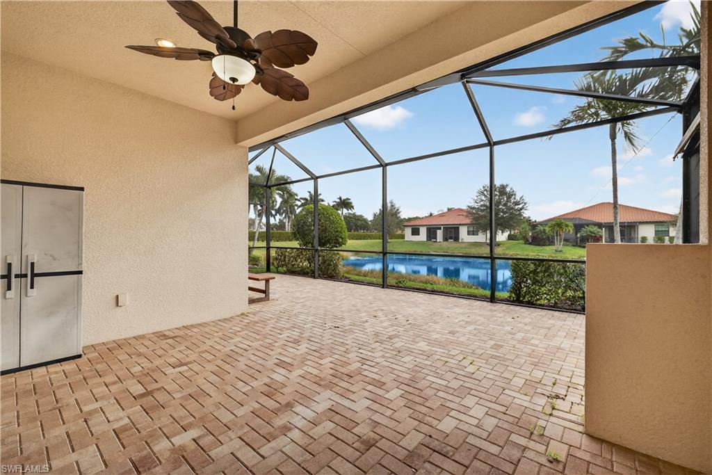 1412 Lucena Lane South Naples, FL 34113 - Photo 30 of 50 Screened lanai plumbed for an outdoor kitchen, ceiling fan and tranquil lake views.