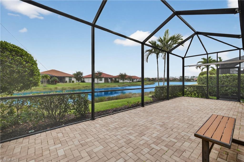 1412 Lucena Lane South Naples, FL 34113 - Photo 30 of 49 Screened lanai plumbed for an outdoor kitchen, ceiling fan and tranquil lake views.