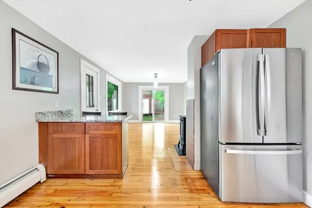 a kitchen with stainless steel appliances a refrigerator and a stove top oven