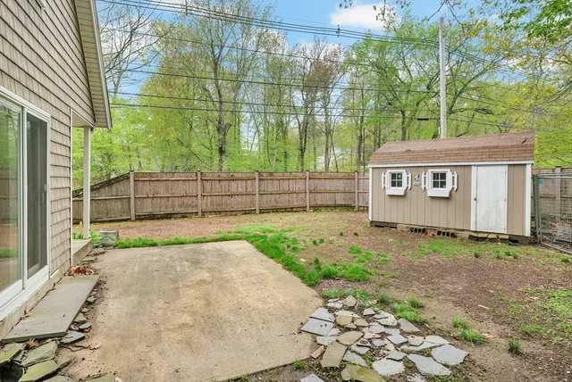 a view of front of house with a yard