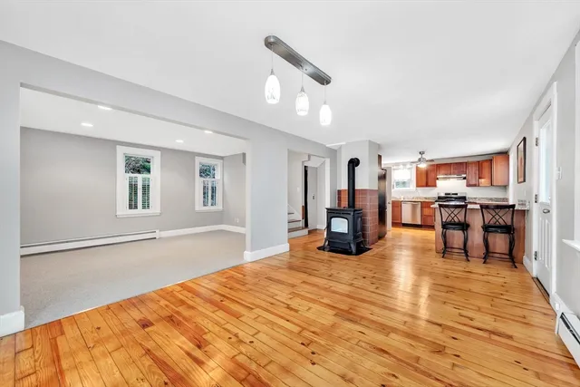 a bedroom with furniture and a wooden floor